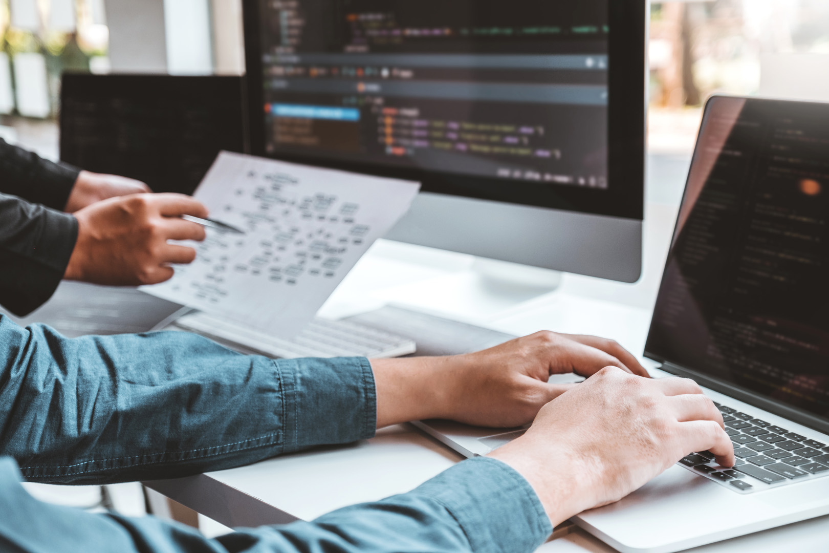 Developing programmer Team Development Website design and coding technologies working in software company office